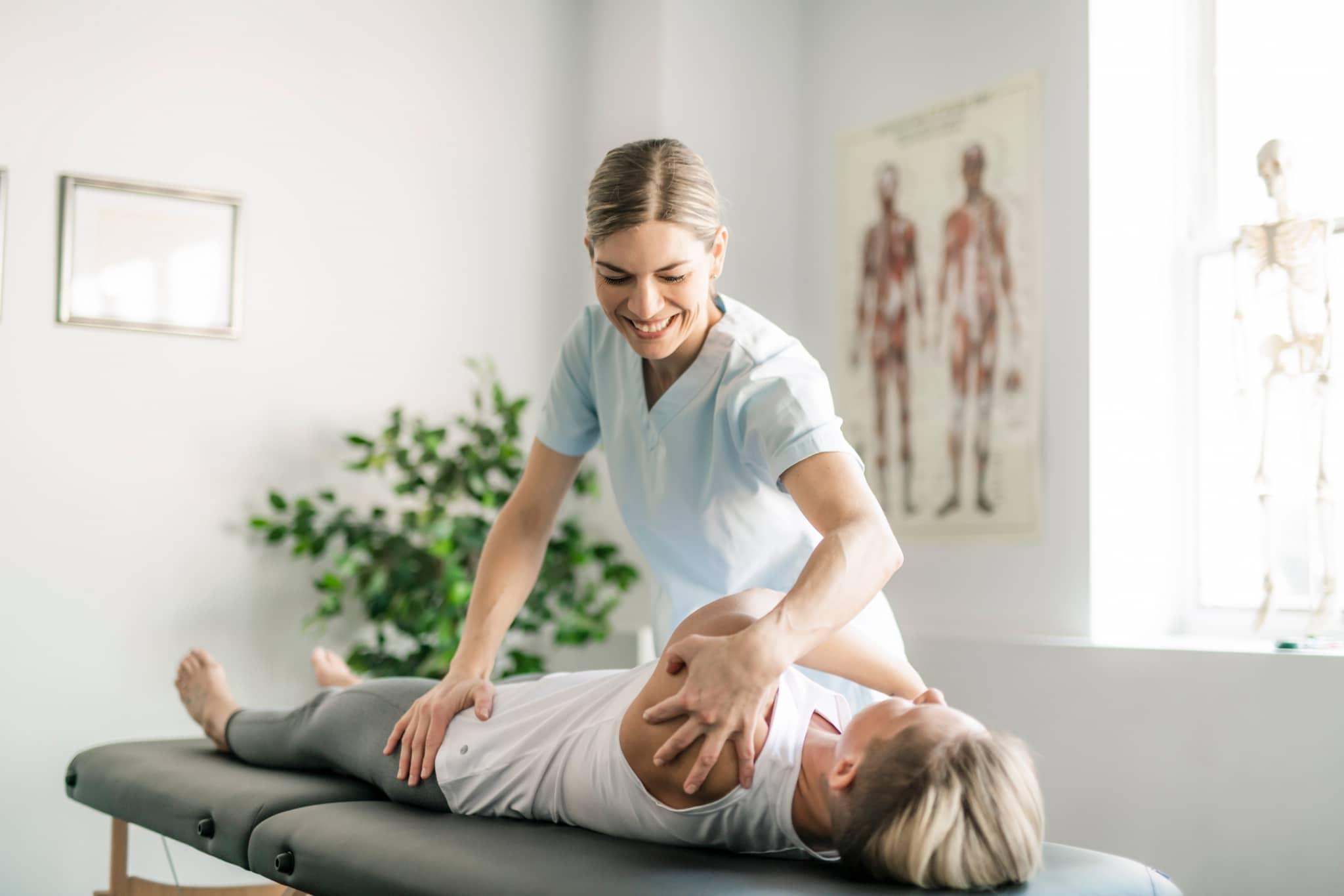 Physical Therapist Assistant assisting a patient